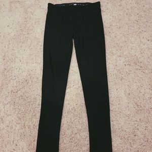 2 pairs of black leggings.